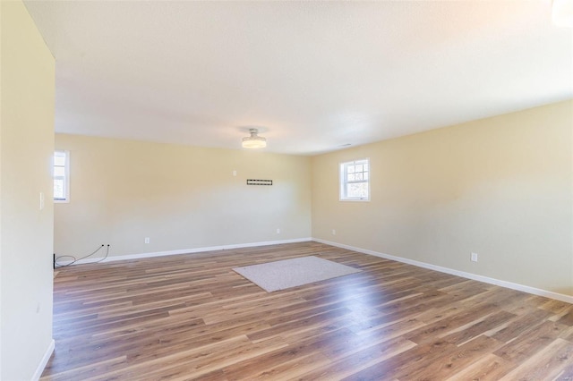 unfurnished room with hardwood / wood-style floors