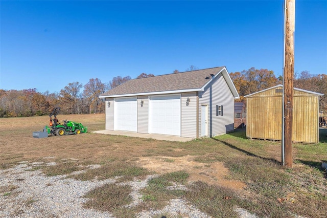 garage featuring a yard