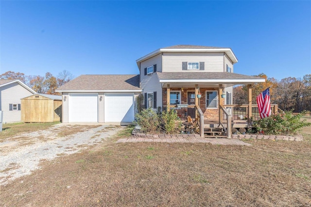 view of front of property featuring a storage unit, a porch, and a front lawn