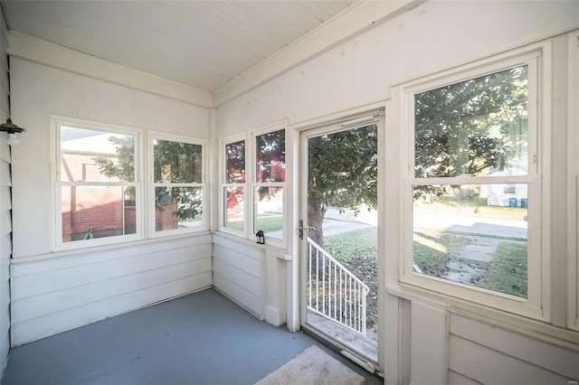 unfurnished sunroom featuring a healthy amount of sunlight