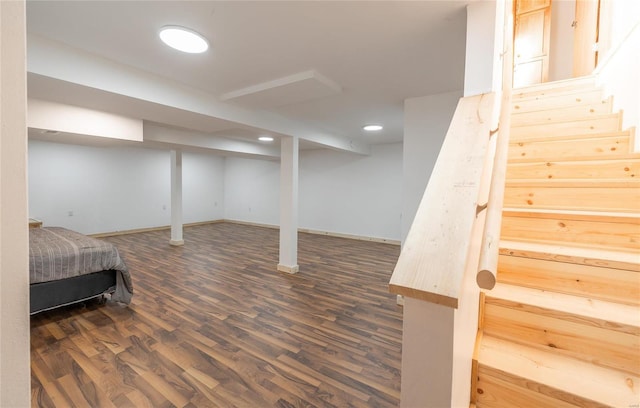 basement featuring dark hardwood / wood-style flooring