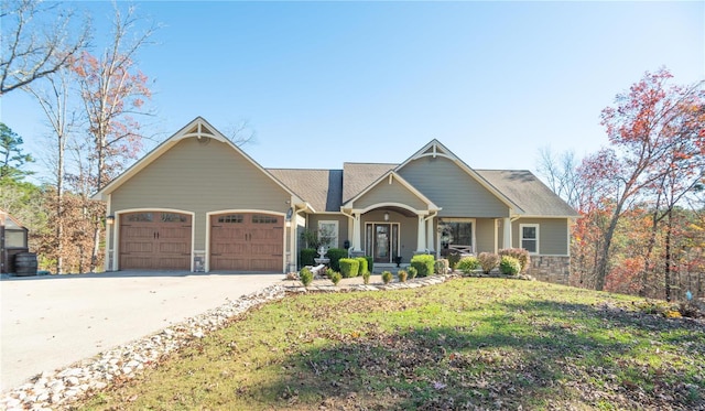 view of front facade with a garage and a front lawn