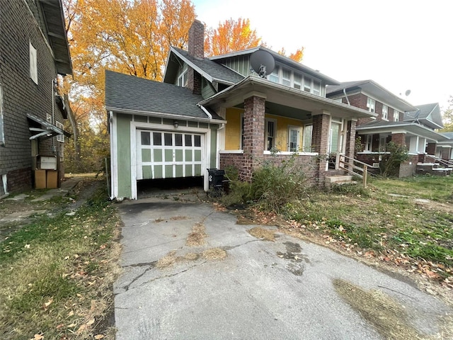 view of front of house with a garage and covered porch