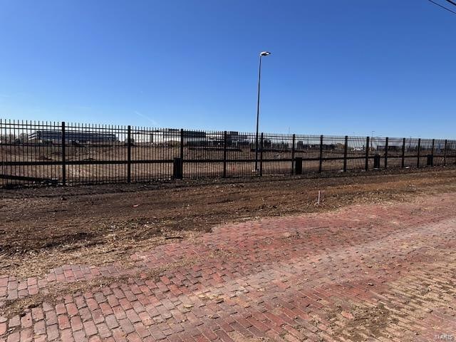 view of yard with a rural view