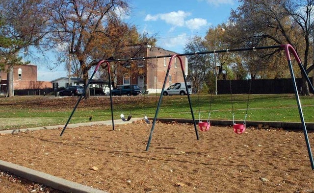 view of playground with a yard