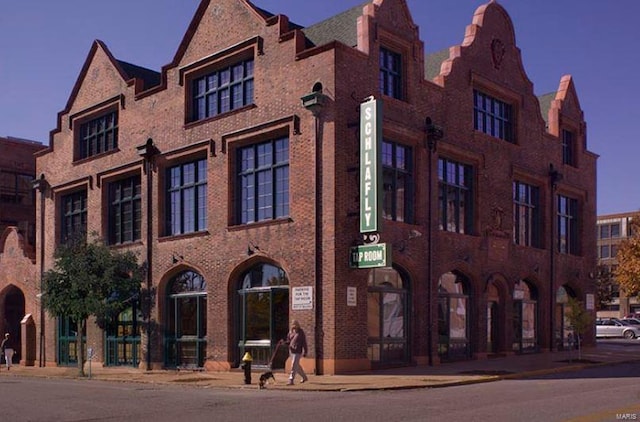 view of outdoor building at dusk