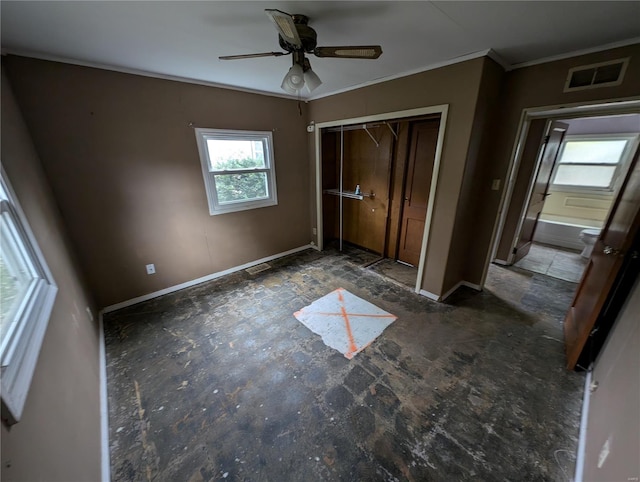 unfurnished bedroom with multiple windows, ceiling fan, a closet, and crown molding