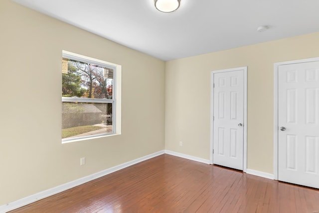 unfurnished bedroom featuring hardwood / wood-style floors