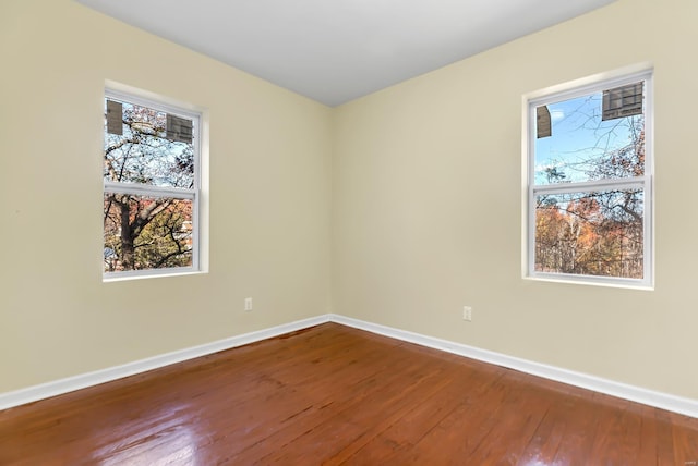 spare room with hardwood / wood-style flooring