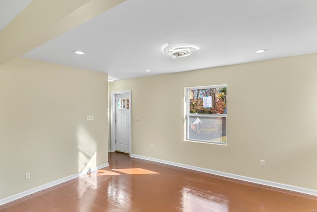 empty room with hardwood / wood-style floors