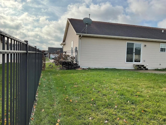 view of side of property featuring a yard