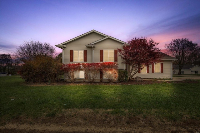 view of front of property with a lawn