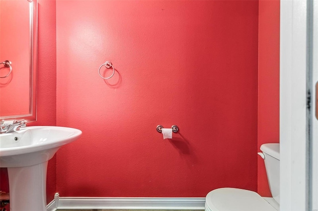 bathroom with toilet and sink