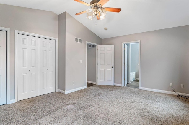 unfurnished bedroom with carpet, ceiling fan, lofted ceiling, and ensuite bath