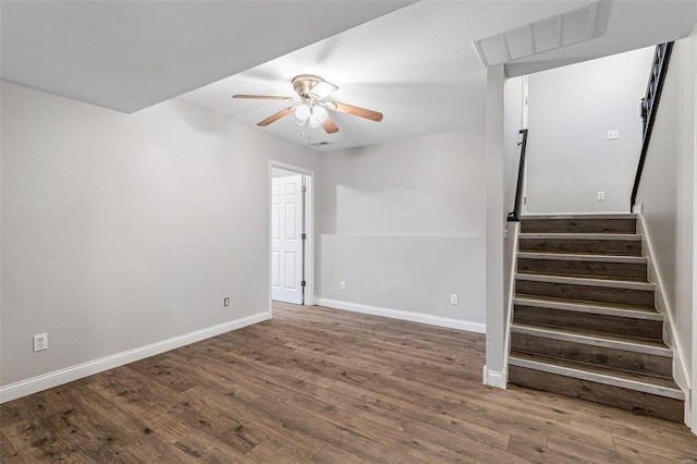 empty room featuring hardwood / wood-style flooring and ceiling fan