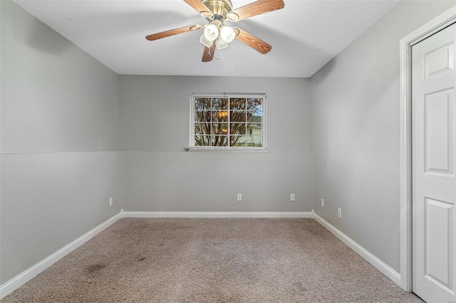 carpeted empty room with ceiling fan