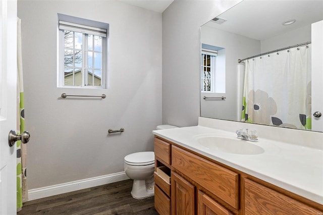 bathroom featuring hardwood / wood-style floors, vanity, and toilet