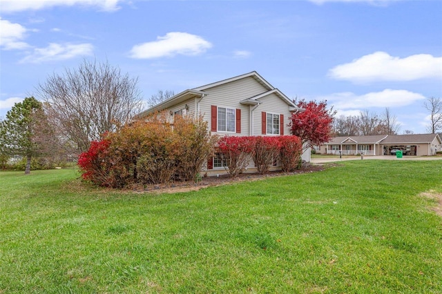 view of home's exterior featuring a lawn