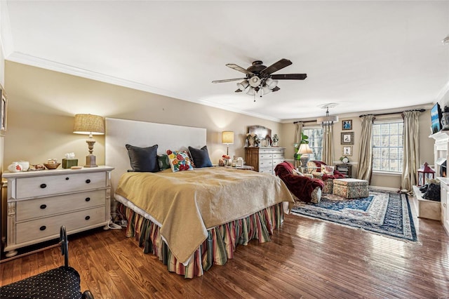 bedroom featuring ornamental molding, ceiling fan, and dark wood-type flooring