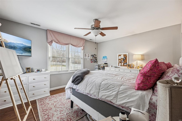 bedroom featuring ceiling fan and dark hardwood / wood-style flooring