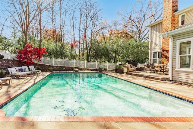 view of swimming pool featuring a patio area