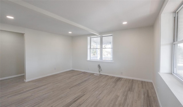 spare room with recessed lighting, light wood-style floors, and baseboards