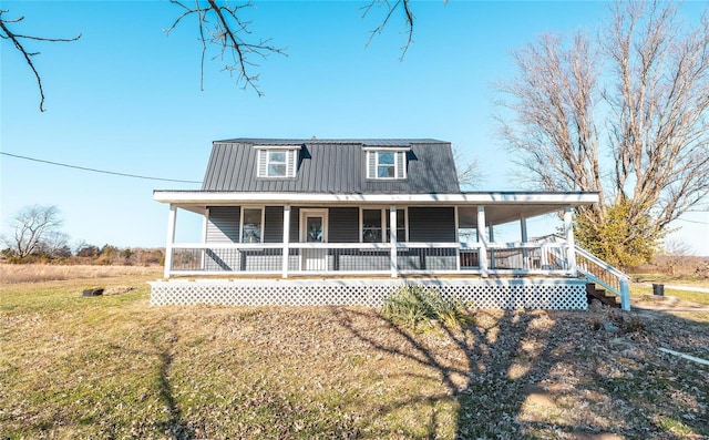 country-style home with covered porch and metal roof