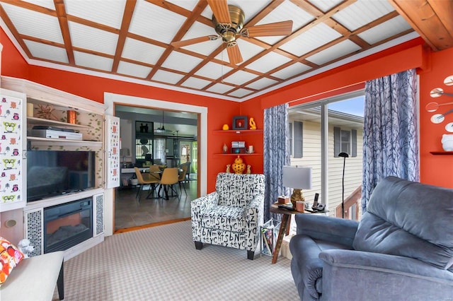 carpeted living room with ceiling fan