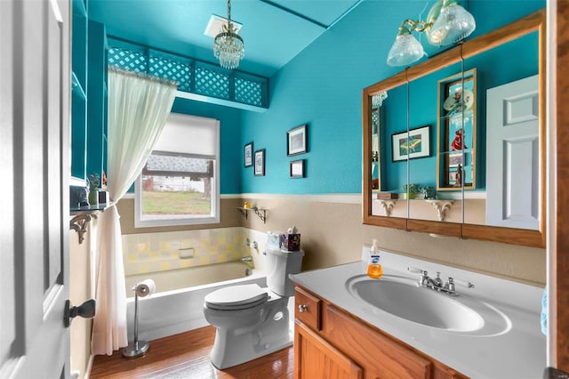 bathroom with a chandelier, hardwood / wood-style floors, vanity, and toilet