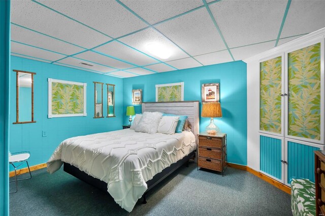 bedroom with a paneled ceiling