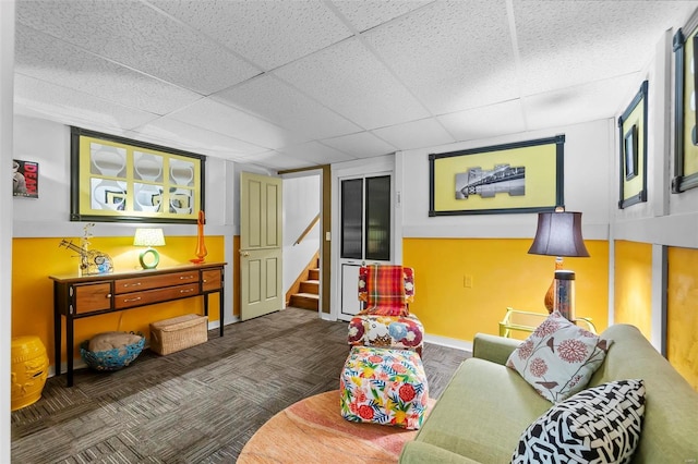 living room featuring a paneled ceiling