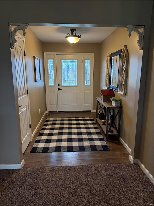 entryway with dark wood-type flooring