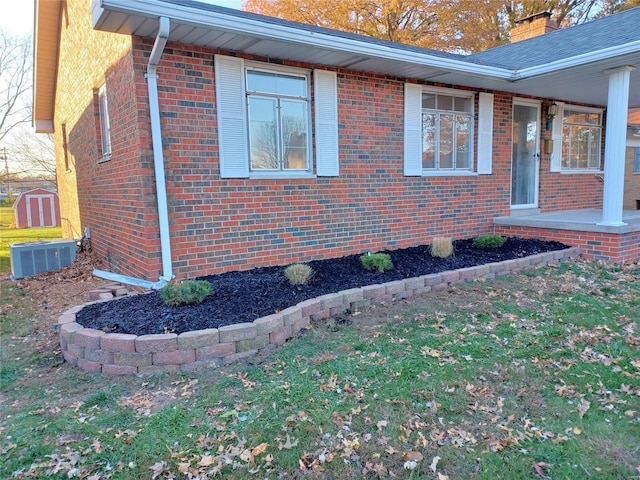 view of side of home featuring central AC