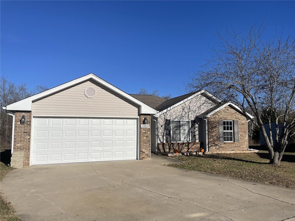 single story home featuring a garage