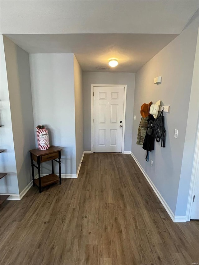 doorway with dark hardwood / wood-style floors