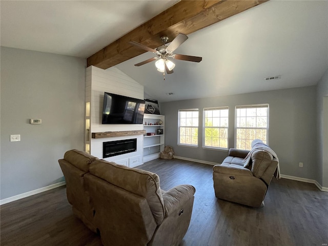 living room with vaulted ceiling with beams, a large fireplace, dark hardwood / wood-style flooring, and ceiling fan