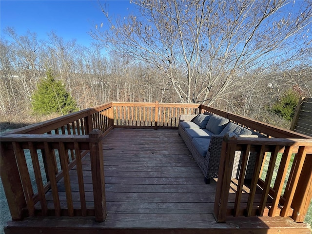 wooden terrace featuring an outdoor hangout area