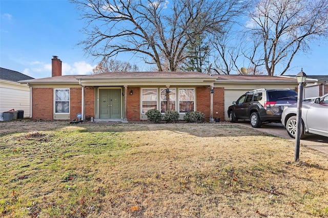 single story home with a garage and a front yard