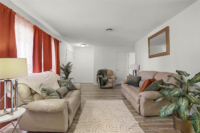 living room with light hardwood / wood-style floors