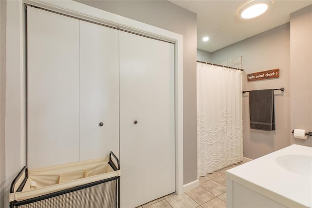 bathroom featuring tile patterned flooring and vanity