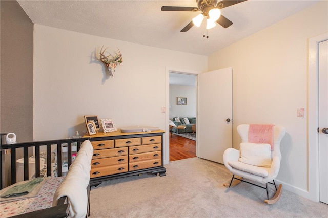 carpeted bedroom featuring ceiling fan