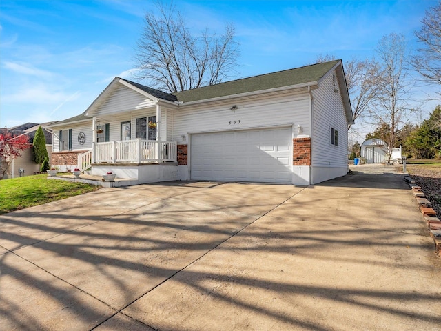 ranch-style house with a porch and a garage