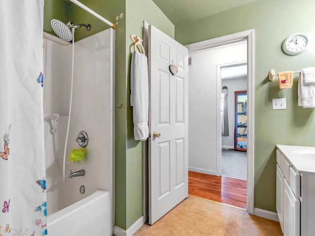 bathroom with hardwood / wood-style floors, vanity, and shower / tub combo with curtain