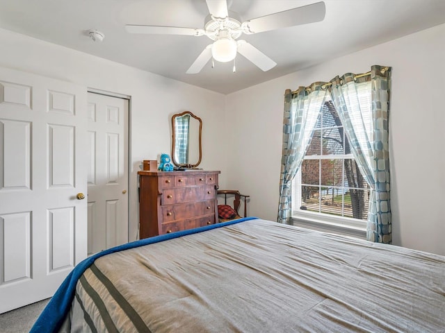 bedroom featuring carpet flooring, a closet, and ceiling fan