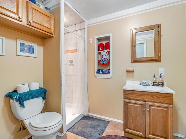 bathroom featuring curtained shower, tile patterned flooring, vanity, and toilet