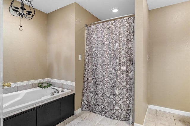 bathroom with tile patterned floors and a bathing tub