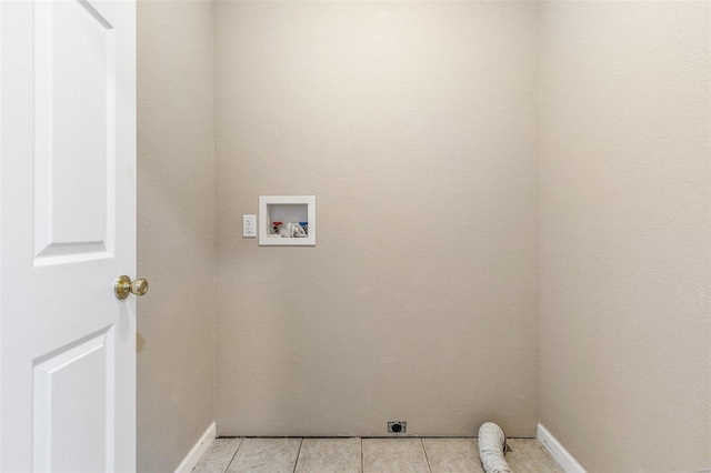 laundry area featuring electric dryer hookup, light tile patterned flooring, and hookup for a washing machine