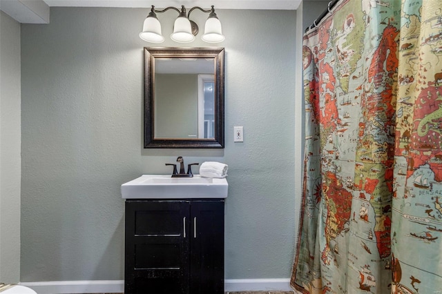 bathroom with a shower with curtain and vanity