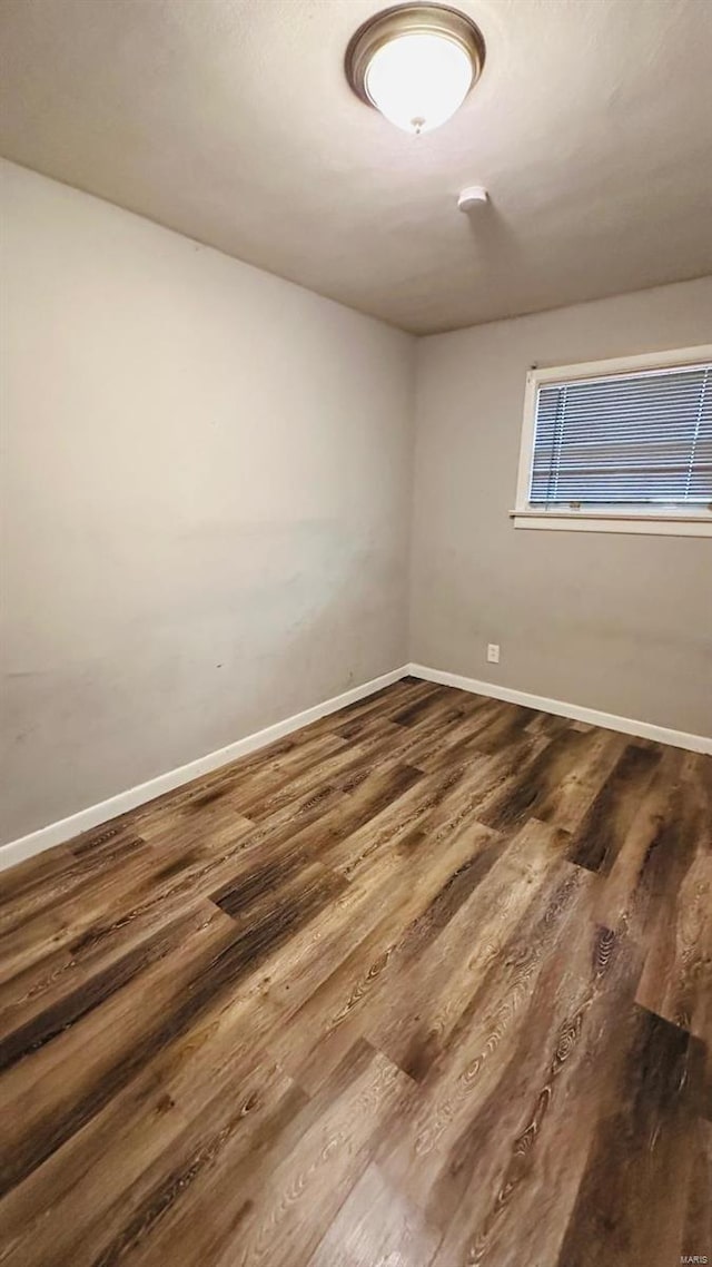 empty room with wood-type flooring