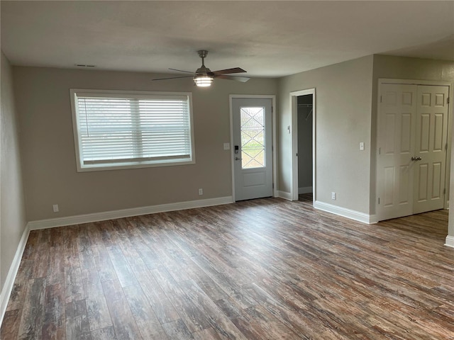 empty room with wood-type flooring and ceiling fan